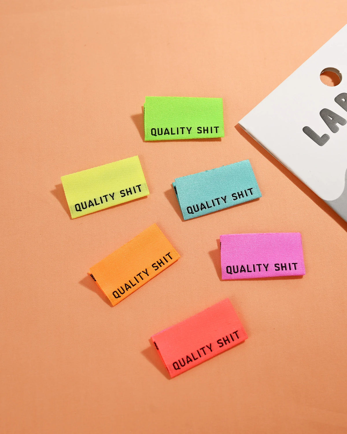 "Quality Shit" NEON Woven Labels 6 Pack