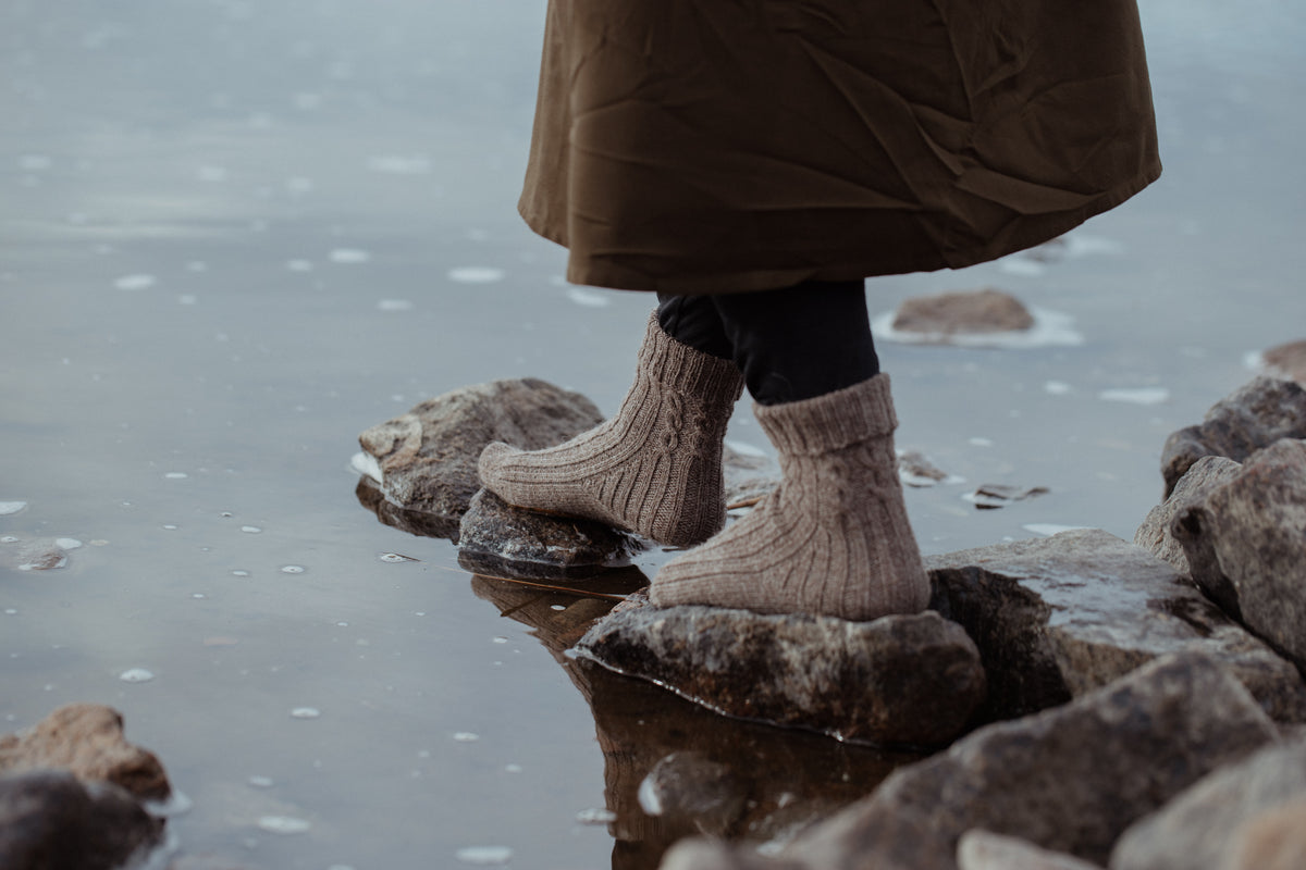 The Island and the Forest: A Knitted Correspondence
