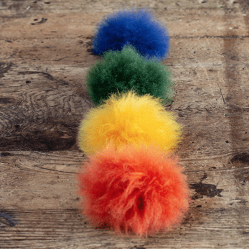 Choose a Colorful Toft Pom Pom made from Alpaca Fur which has a snap to sew  on to your knitwear. Snap on and off for washing or to change the look  of